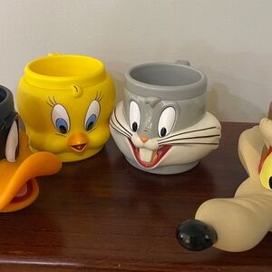 4 plastic cartoon character mugs